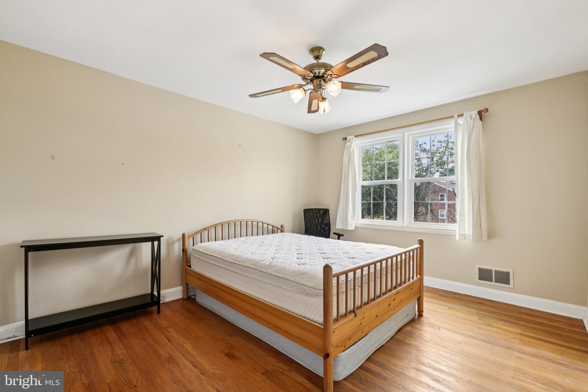 130 Dumbarton Road Baltimore, MD 21212 - Photo 16 of 34 a bedroom with a bed and a window