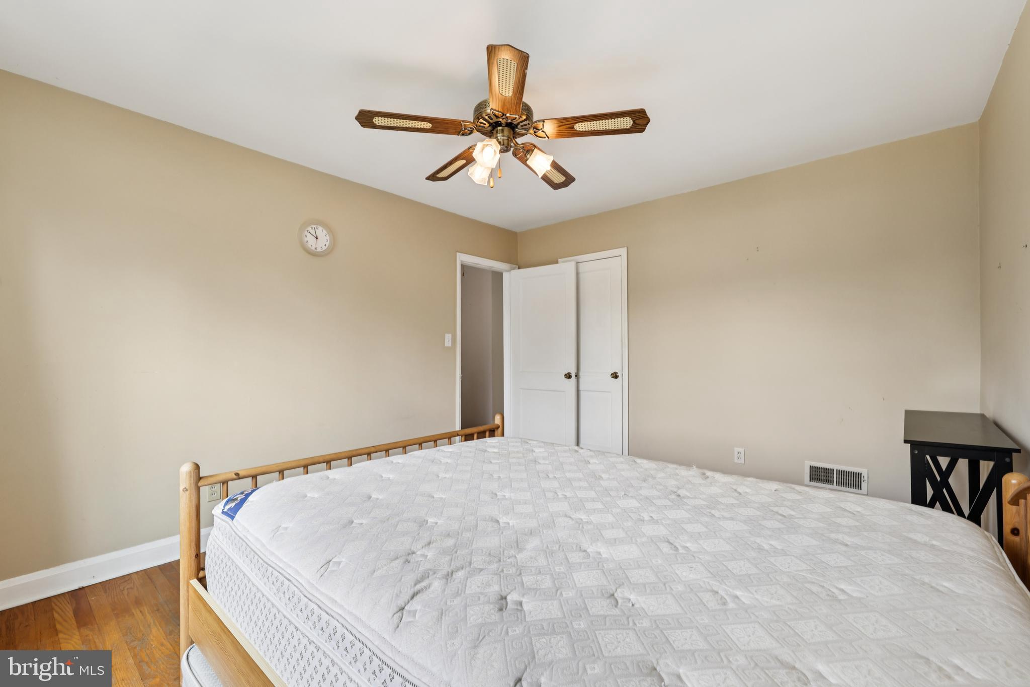 130 Dumbarton Road Baltimore, MD 21212 - Photo 17 of 34 a bedroom with a bed and a ceiling fan