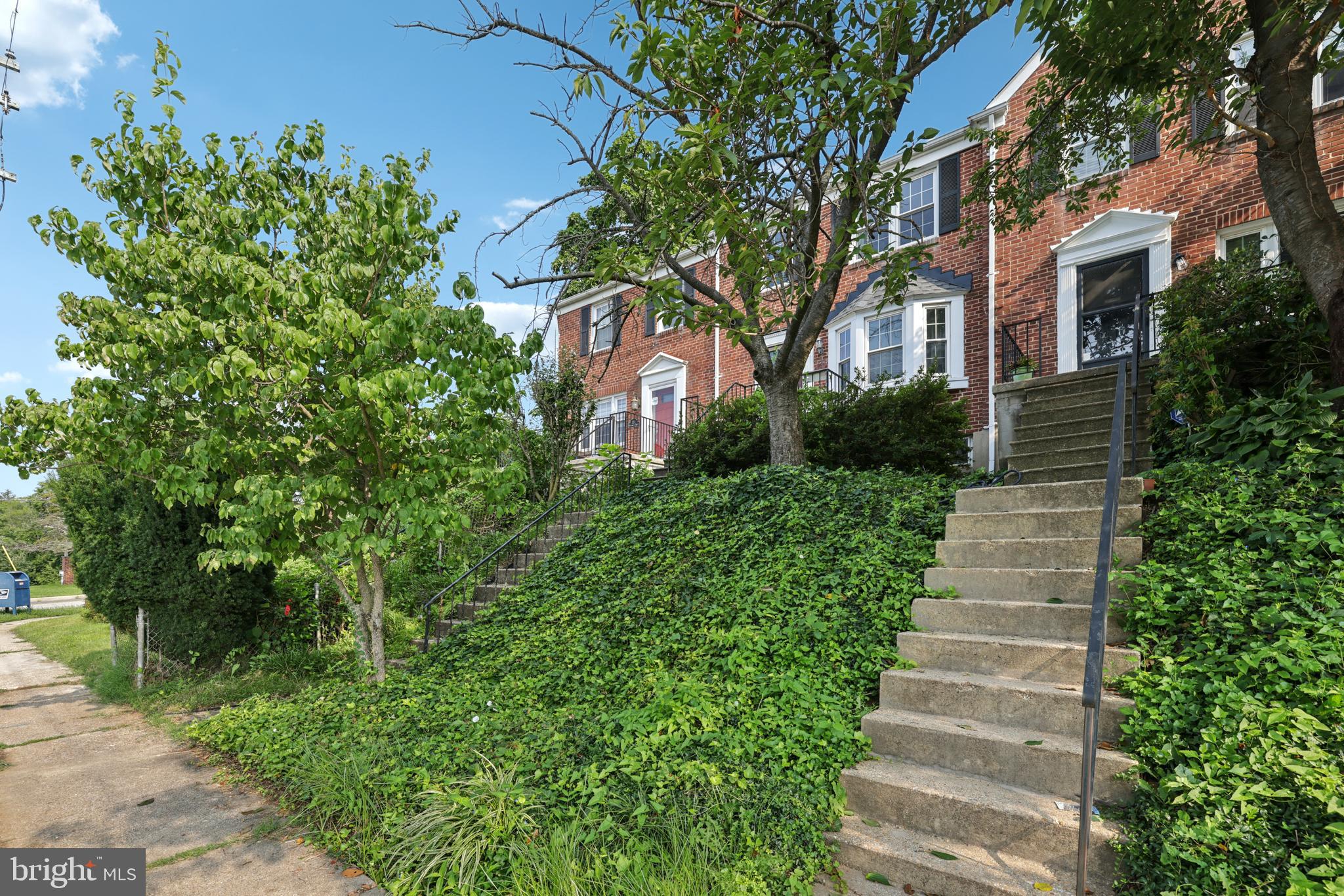 130 Dumbarton Road Baltimore, MD 21212 - Photo 3 of 34 a front view of a house with a yard