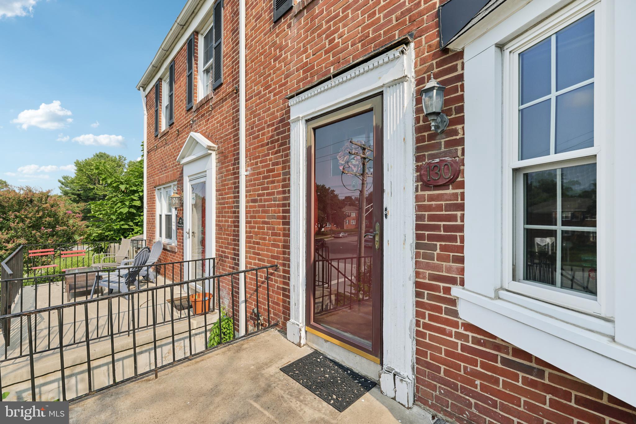 130 Dumbarton Road Baltimore, MD 21212 - Photo 4 of 34 a view of a brick house that has large windows