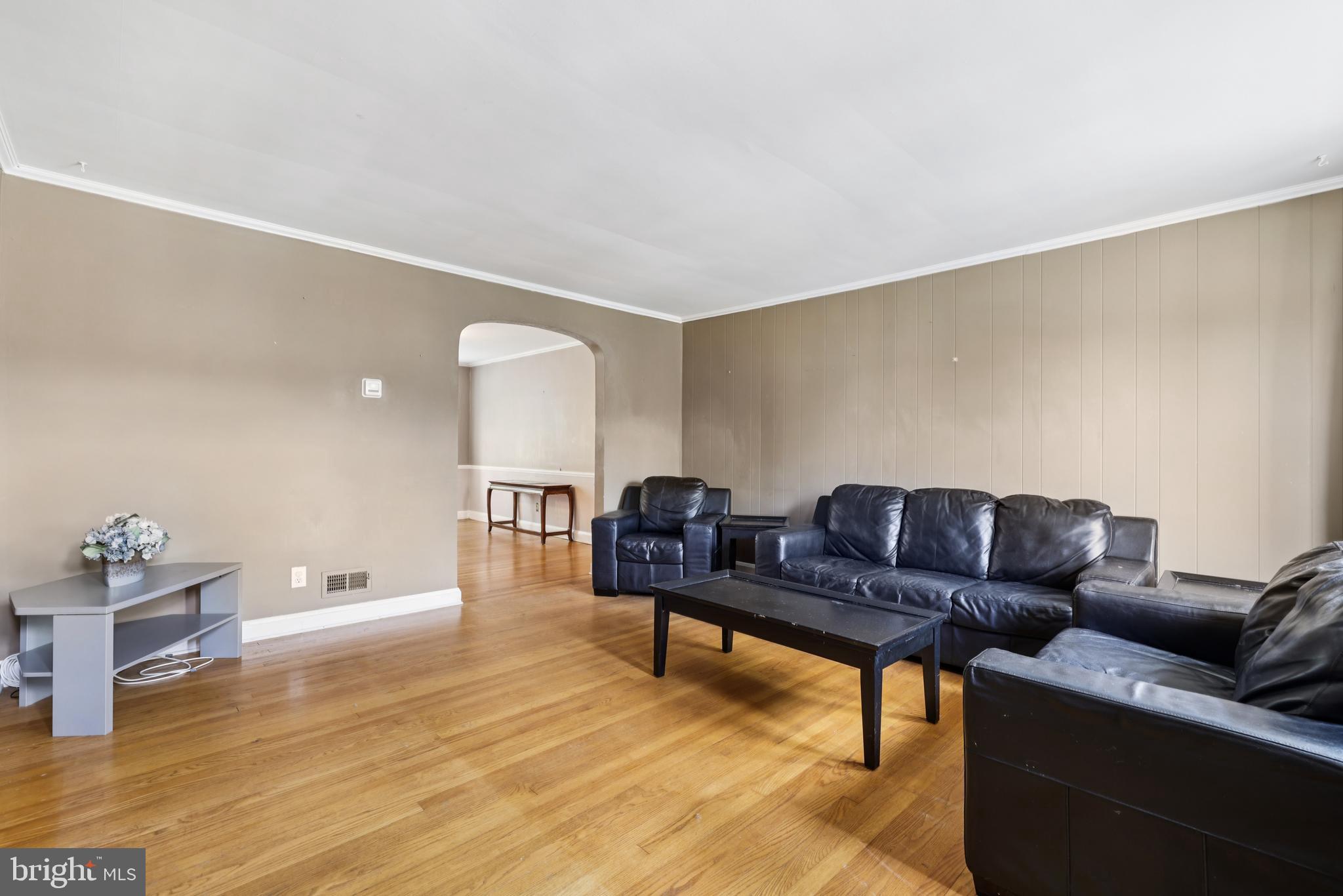 130 Dumbarton Road Baltimore, MD 21212 - Photo 5 of 34 a living room with furniture and a wooden floor