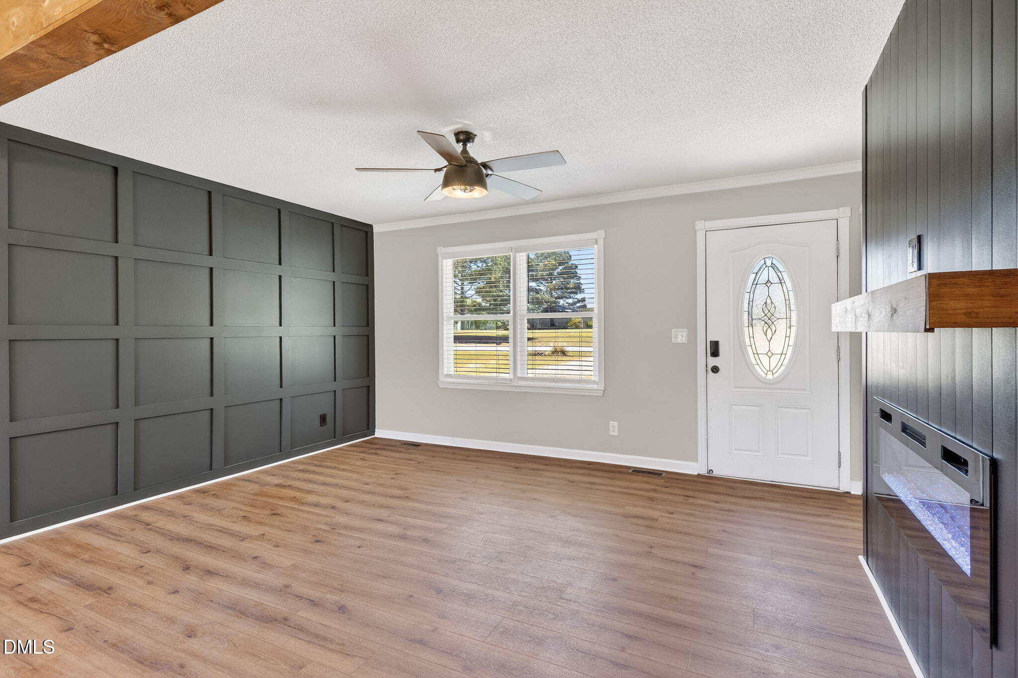 6086 Red Hill Church Road Coats, NC 27521 - Photo 7 of 44 a view of empty room with wooden floor and fan