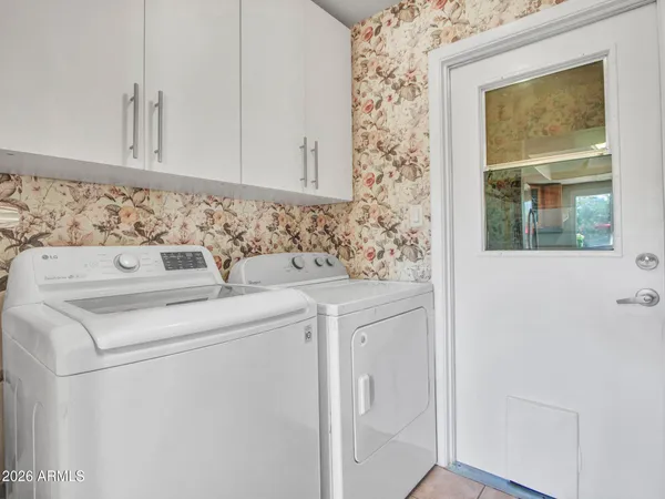 a utility room with dryer and washer