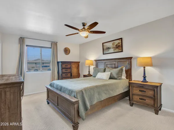 a bedroom with a bed and a table