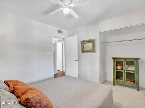 a view of living room with patio furniture and potted plants