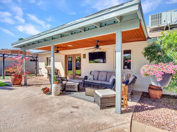 a view of backyard with a table and chairs