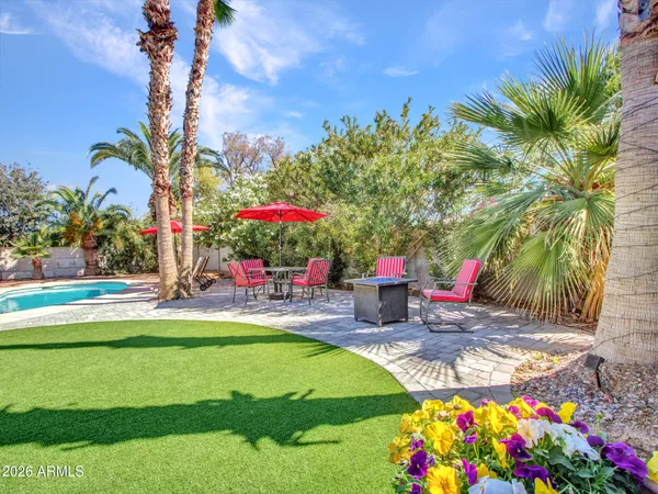 a view of a backyard with sitting area