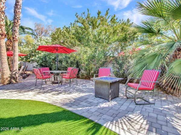 a green field with flowers in it