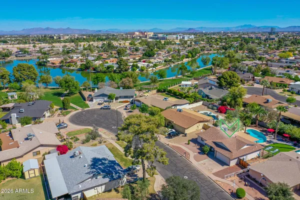 an aerial view of residential houses with outdoor space