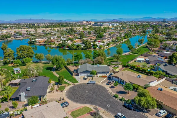 an aerial view of a house with a lake view