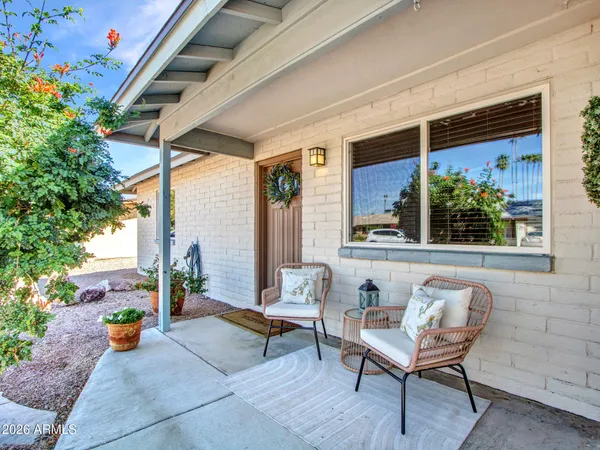 a outdoor living space with furniture and potted plants