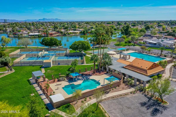 an aerial view of residential houses with outdoor space