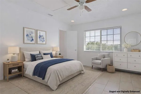 a bedroom with a bed and a couch