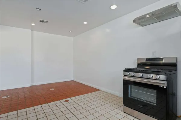 a view of an empty room with a fireplace