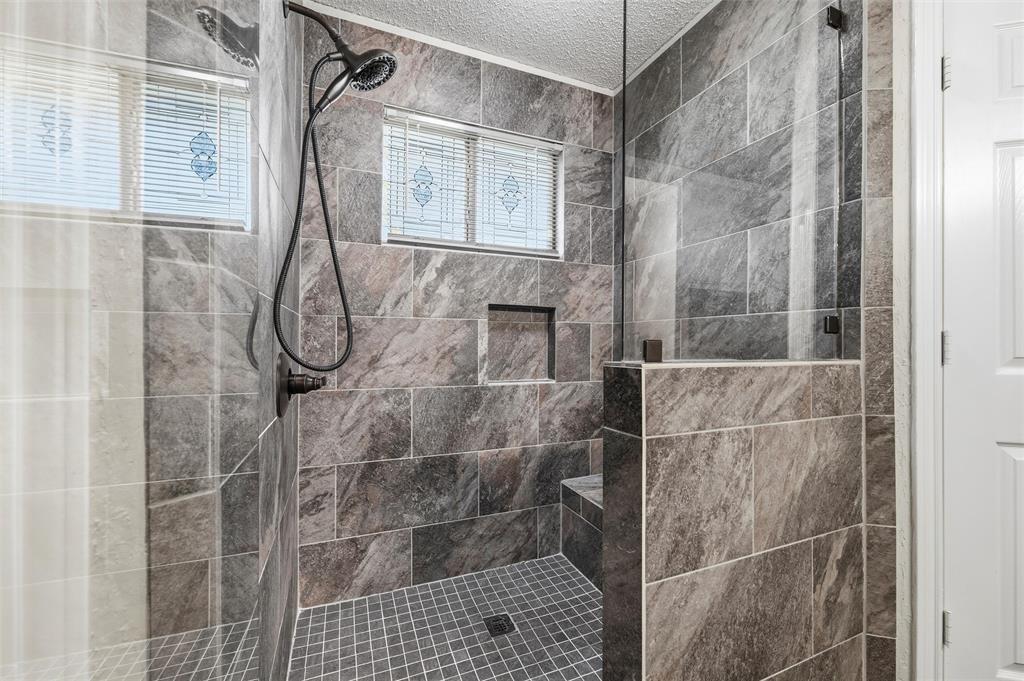 517 Hiwasee Road Waxahachie, TX 75165 - Photo 18 of 38 a bathroom with a shower