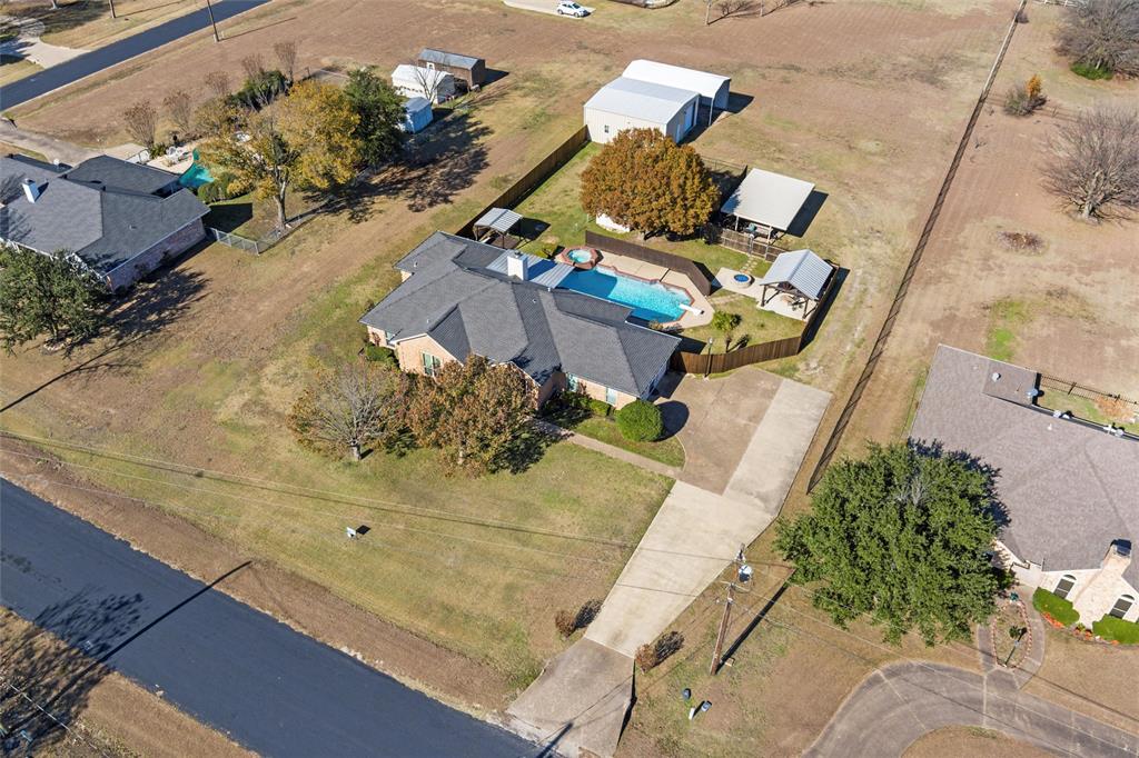 517 Hiwasee Road Waxahachie, TX 75165 - Photo 2 of 38 an aerial view of residential houses with outdoor space