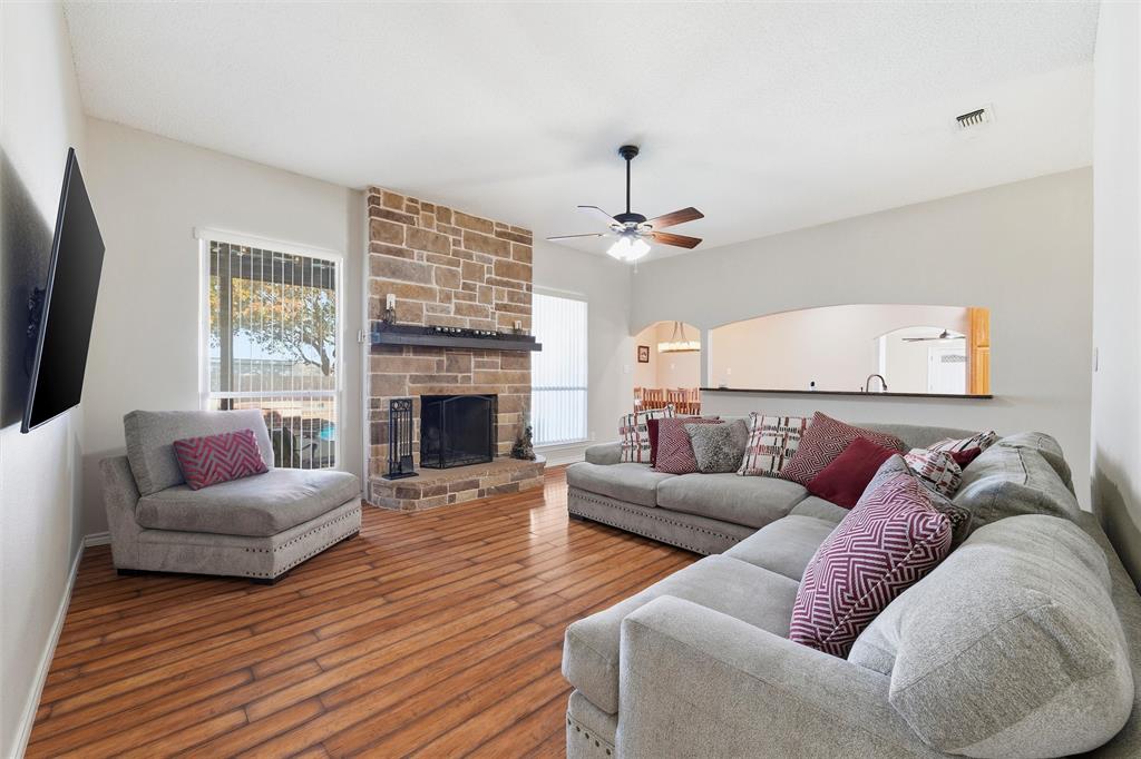 517 Hiwasee Road Waxahachie, TX 75165 - Photo 3 of 38 a living room with furniture and a fireplace