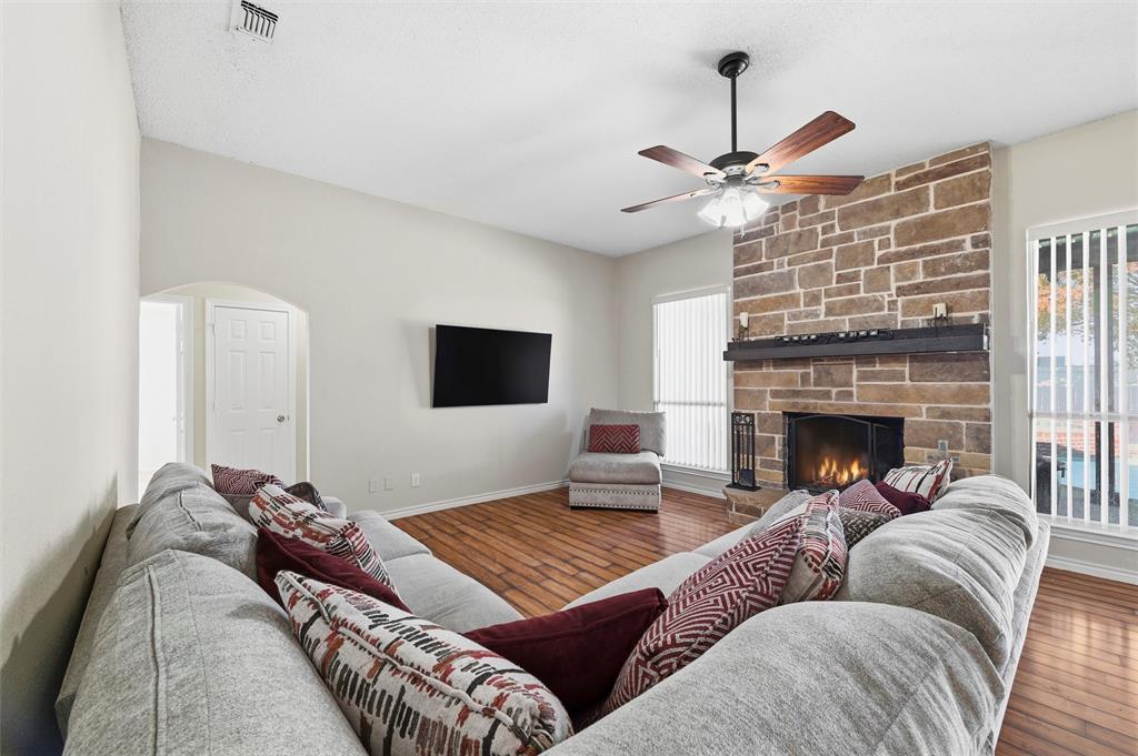 517 Hiwasee Road Waxahachie, TX 75165 - Photo 4 of 38 a living room with furniture and a fireplace