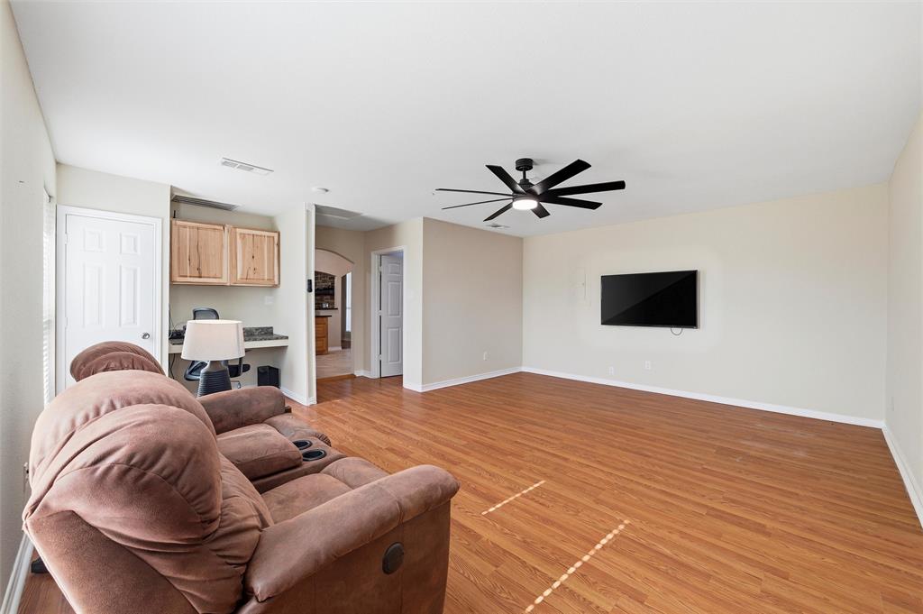 517 Hiwasee Road Waxahachie, TX 75165 - Photo 5 of 38 a living room with furniture and a flat screen tv