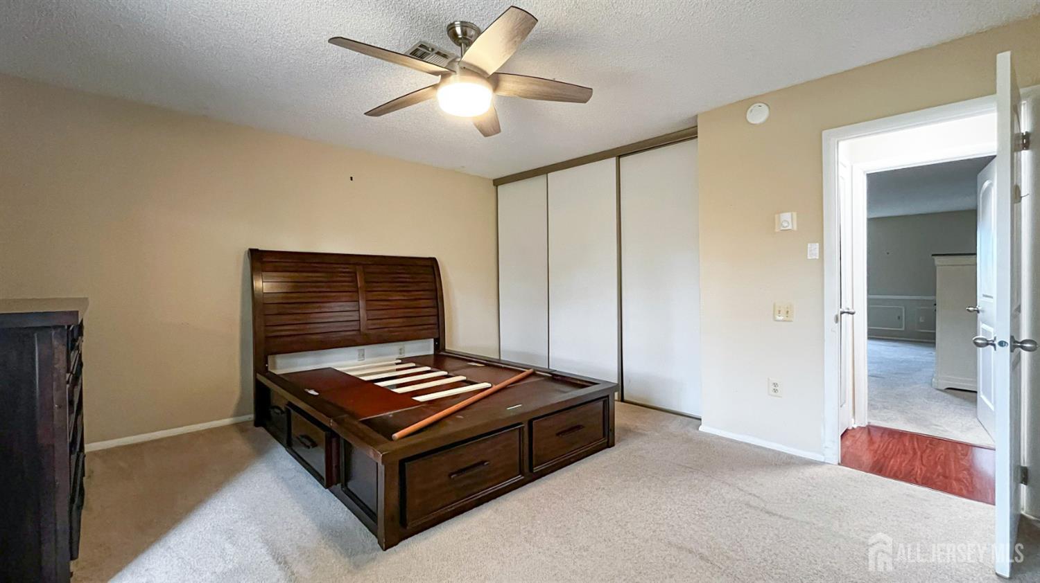 719 Delair Road, Unit B Monroe Township, NJ 08831 - Photo 13 of 21 a room with furniture and a ceiling fan