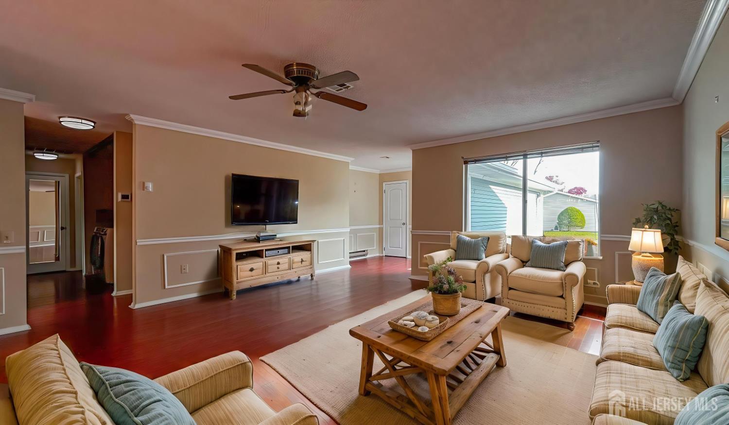 719 Delair Road, Unit B Monroe Township, NJ 08831 - Photo 19 of 21 a living room with furniture and a flat screen tv