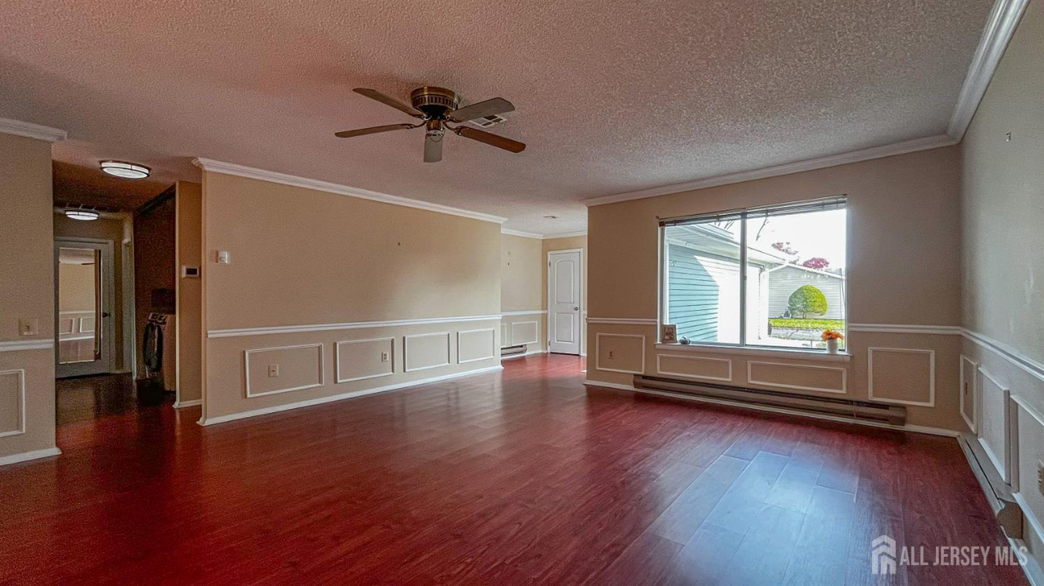 719 Delair Road, Unit B Monroe Township, NJ 08831 - Photo 6 of 21 a view of empty room with wooden floor and fan