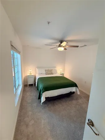 a bedroom with a bed and window