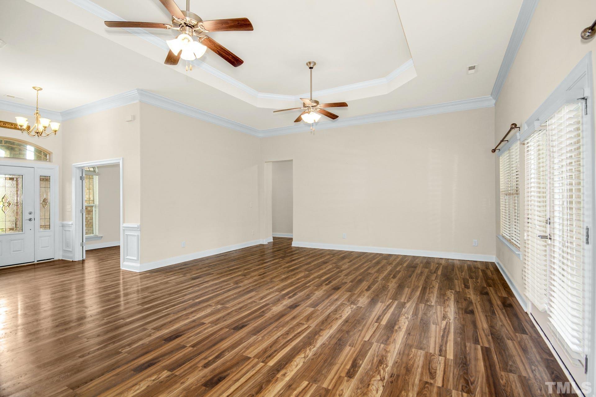 44 Destiny Circle Angier, NC 27501 - Photo 12 of 35 wooden floor in an empty room with a window