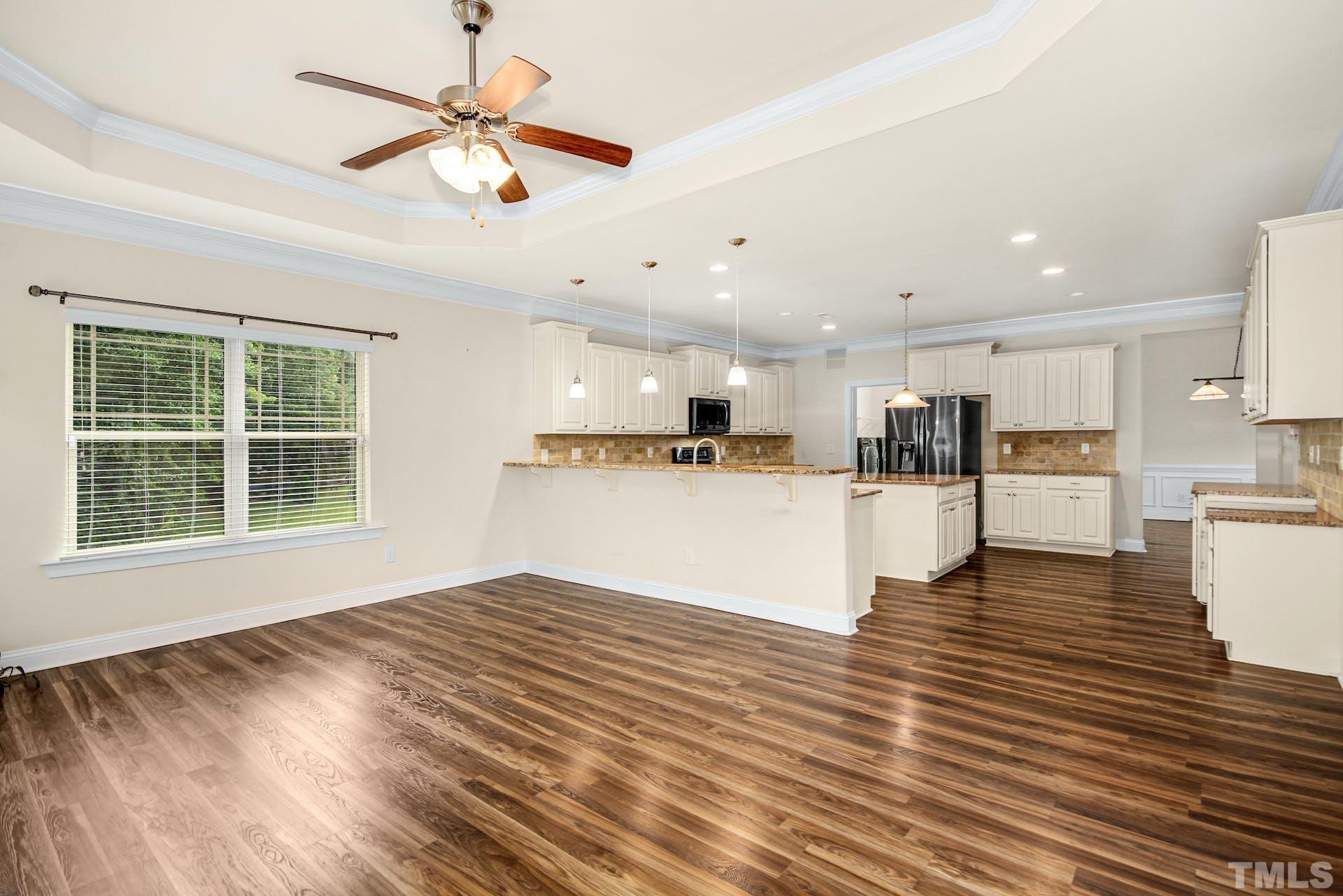 44 Destiny Circle Angier, NC 27501 - Photo 14 of 35 a view of kitchen and kitchen with wooden floor