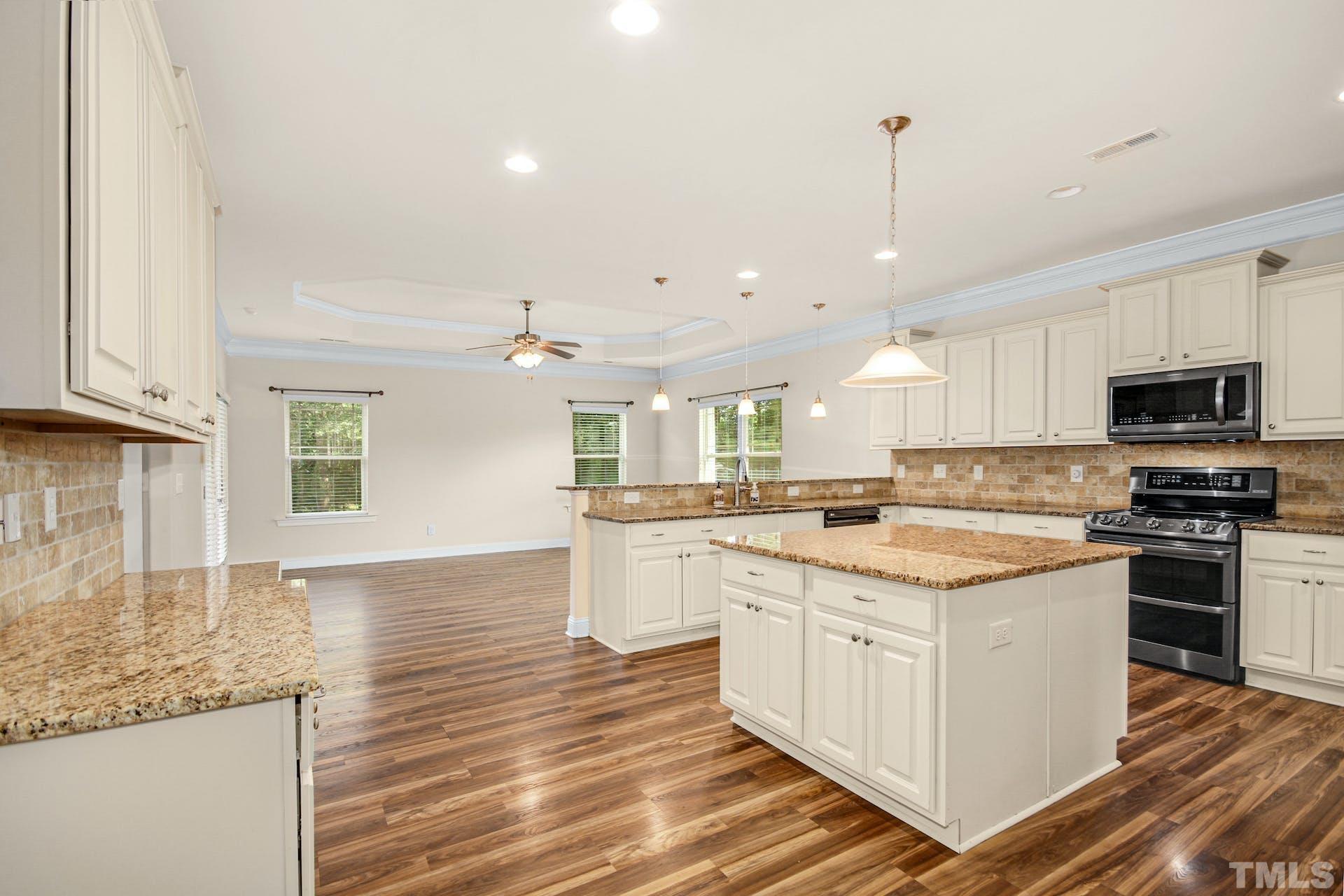 44 Destiny Circle Angier, NC 27501 - Photo 16 of 35 a kitchen with a sink stove and microwave