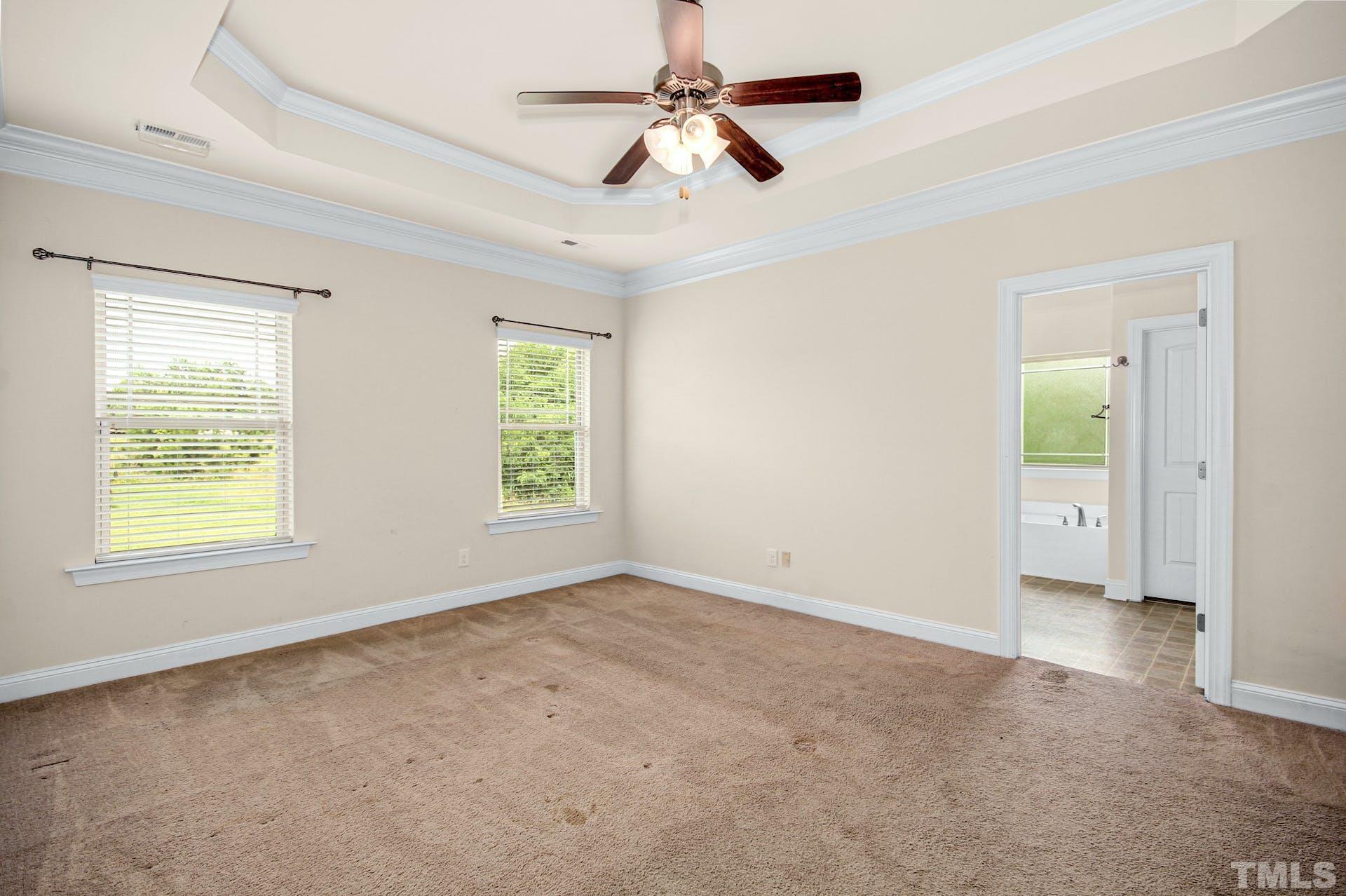 44 Destiny Circle Angier, NC 27501 - Photo 19 of 35 an empty room with windows and fan