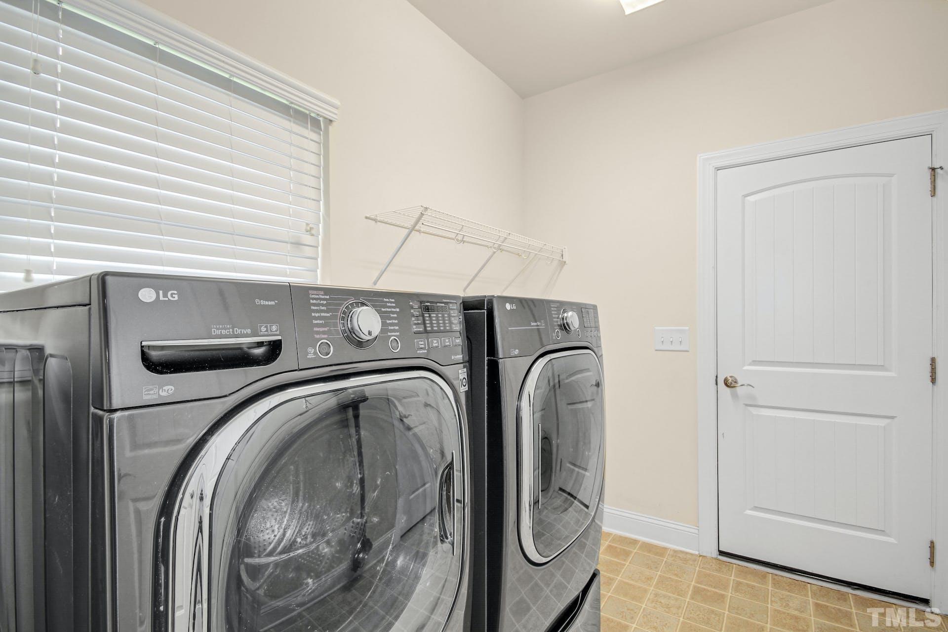44 Destiny Circle Angier, NC 27501 - Photo 27 of 35 a utility room with dryer and washer
