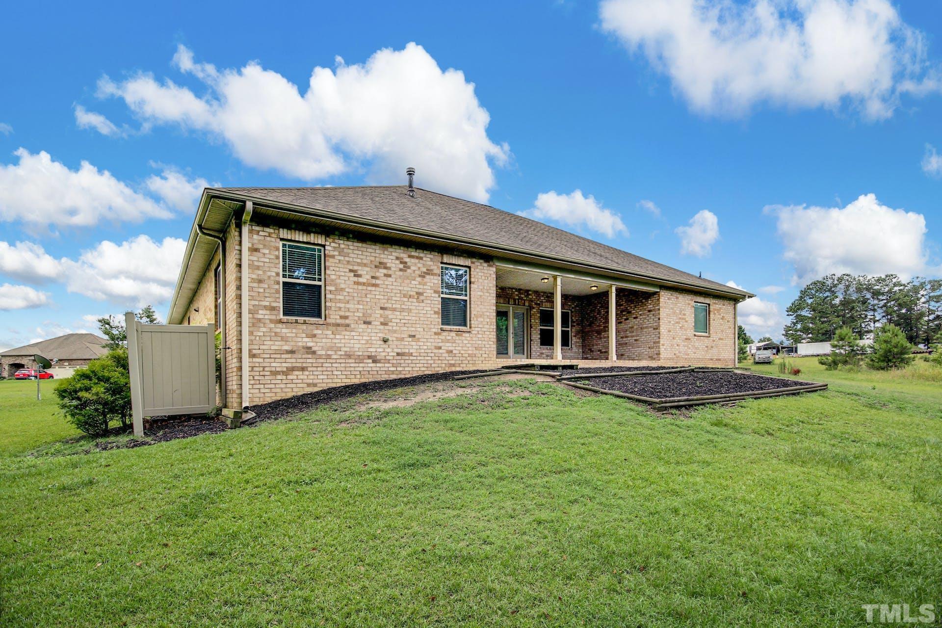 44 Destiny Circle Angier, NC 27501 - Photo 29 of 35 a front view of a house with garden