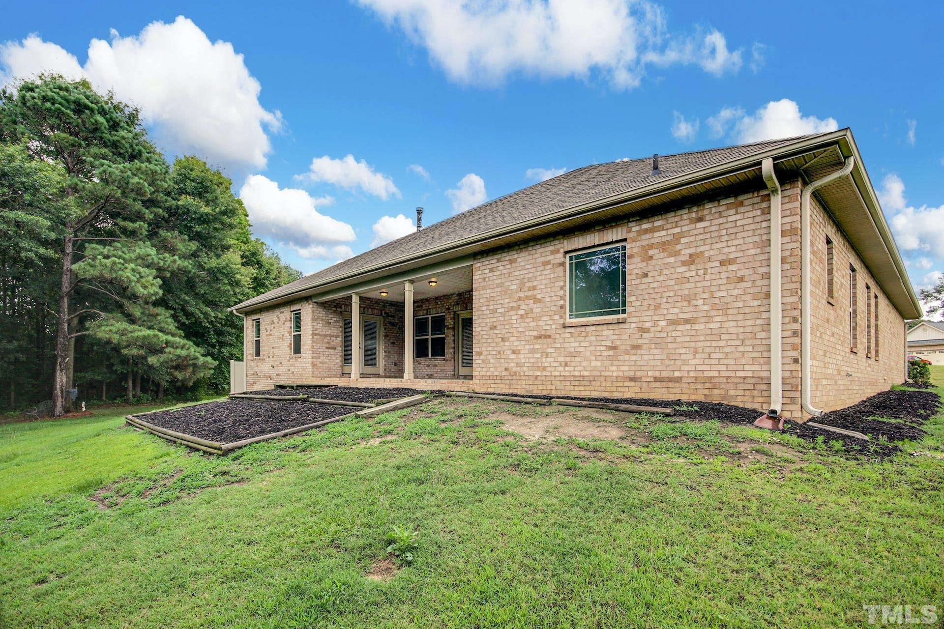 44 Destiny Circle Angier, NC 27501 - Photo 30 of 35 a backyard of a house with lots of green space