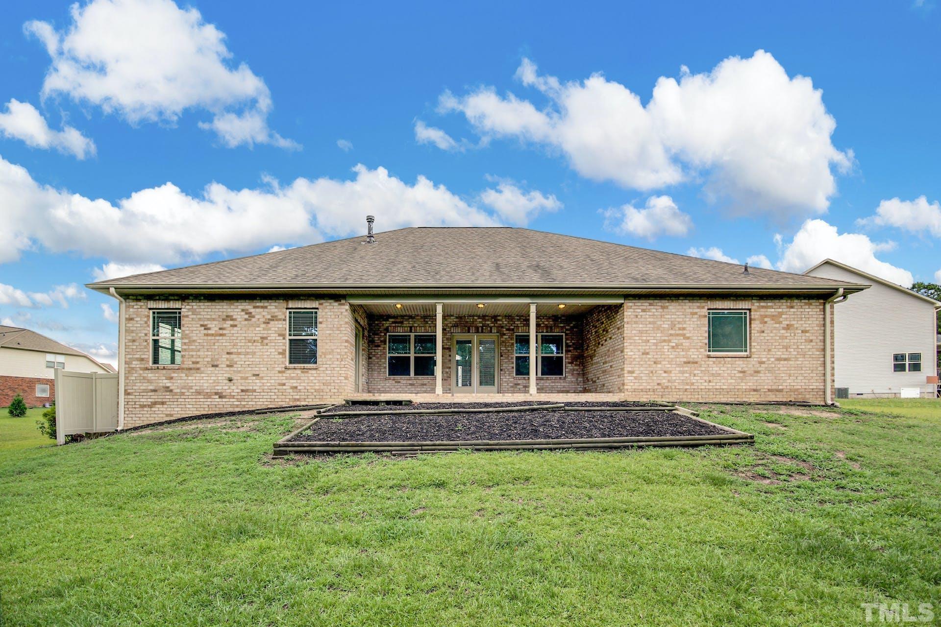 44 Destiny Circle Angier, NC 27501 - Photo 31 of 35 a front view of a house with a garden