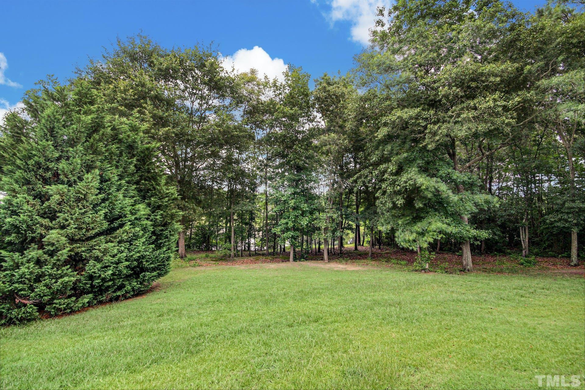 44 Destiny Circle Angier, NC 27501 - Photo 32 of 35 a view of green field with trees in the background
