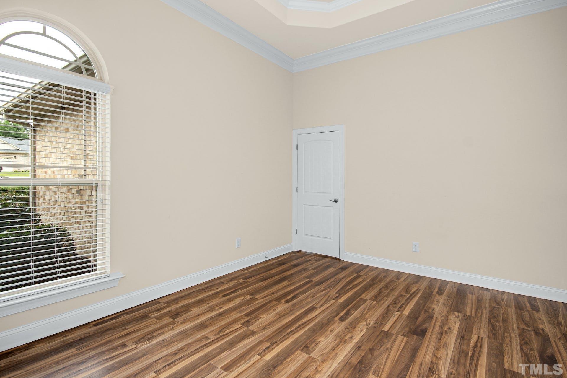 44 Destiny Circle Angier, NC 27501 - Photo 8 of 35 a view of a room with wooden floor and a window
