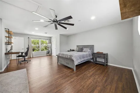 a bedroom with a bed furniture and a window