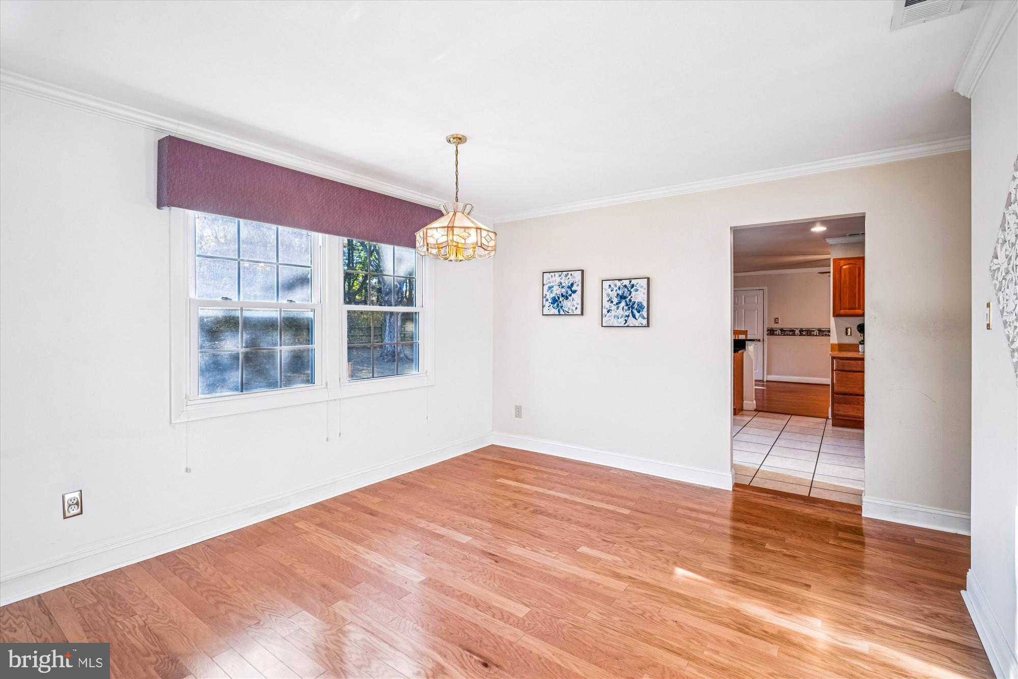 5134 West Running Brook Road Columbia, MD 21044 - Photo 15 of 99 a view of empty room with wooden floor and fan