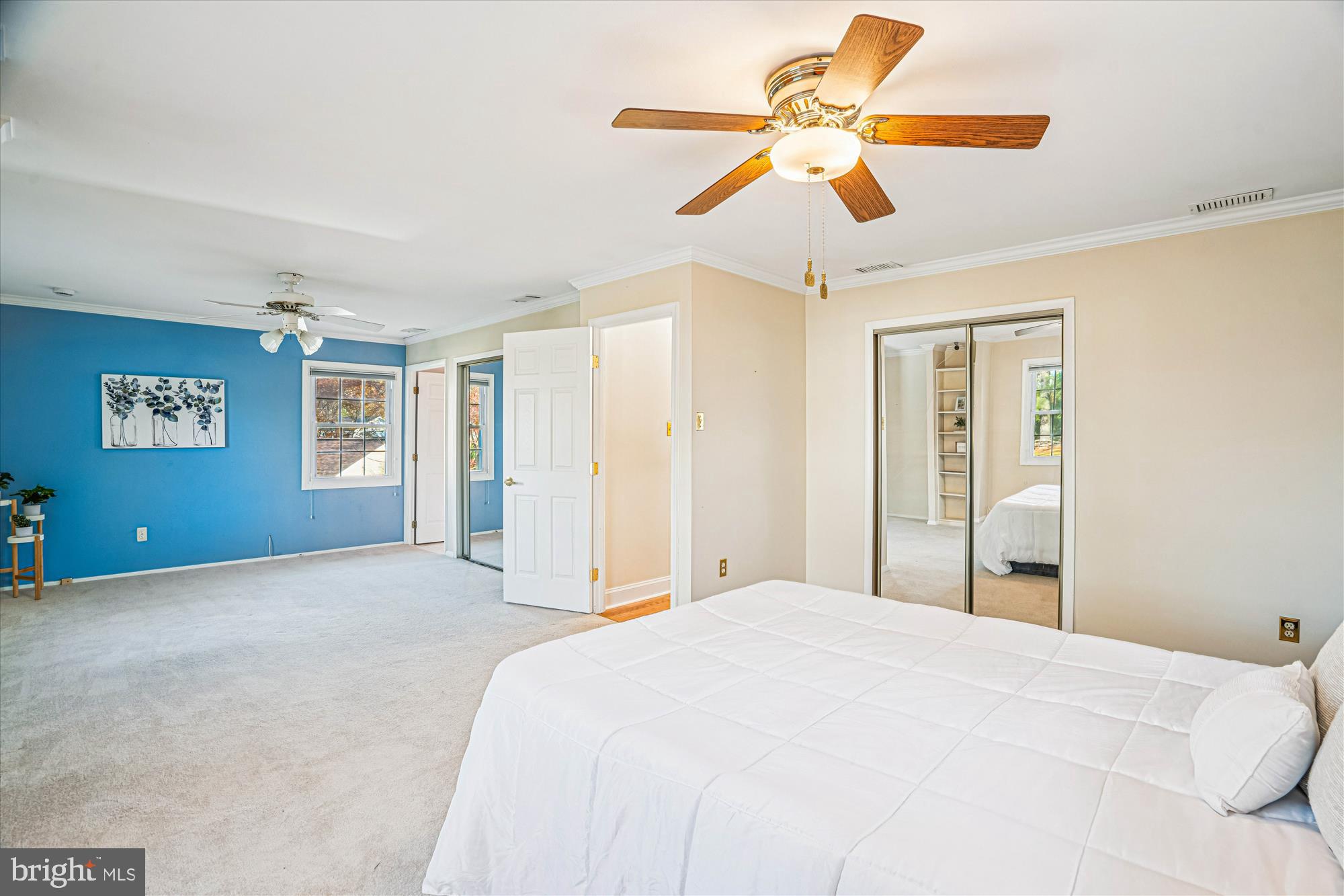 5134 West Running Brook Road Columbia, MD 21044 - Photo 55 of 99 a bedroom with a bed and a chandelier