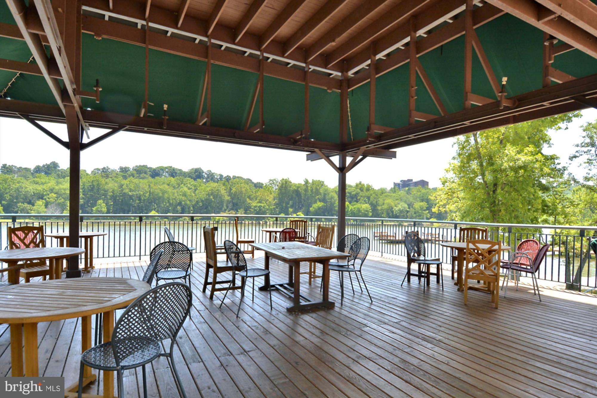 5134 West Running Brook Road Columbia, MD 21044 - Photo 96 of 99 a view of a chairs and table in patio with a small yard