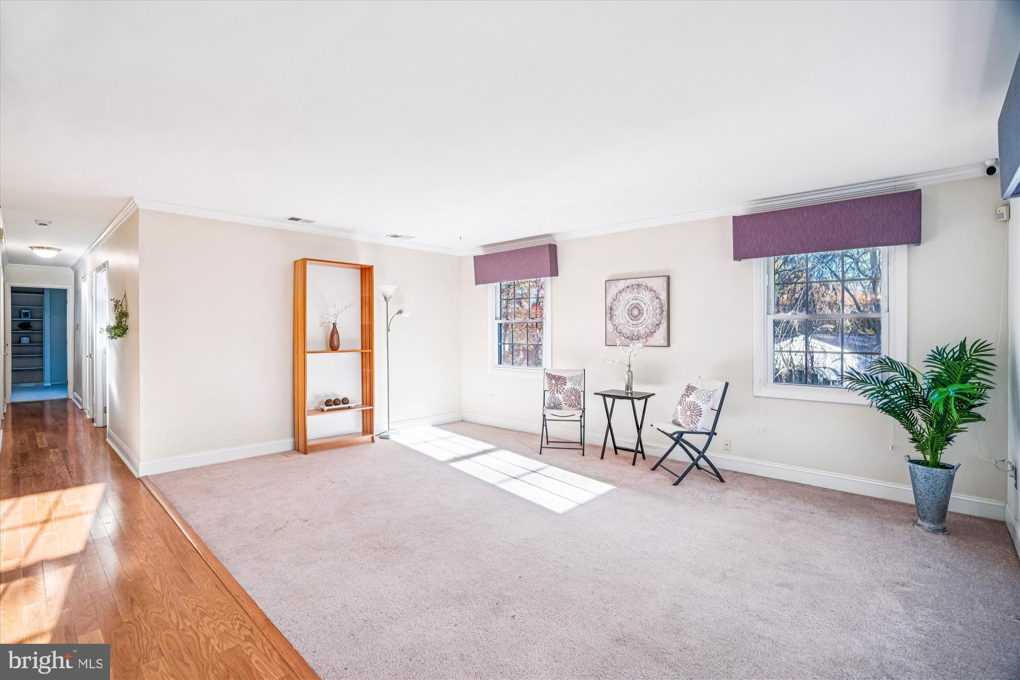 5134 West Running Brook Road Columbia, MD 21044 - Photo 10 of 99 a spacious bedroom with a bed and a table in it