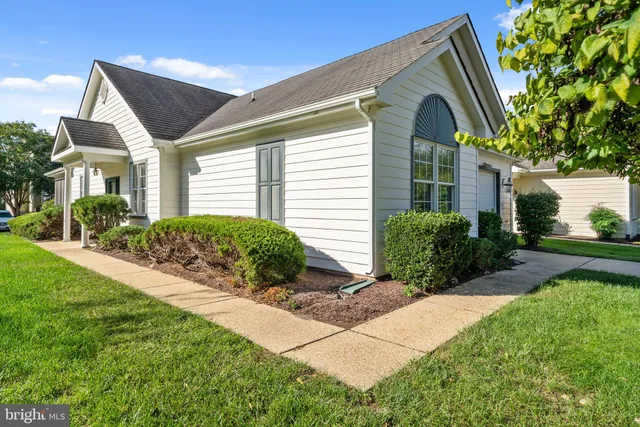 a front view of a house with yard
