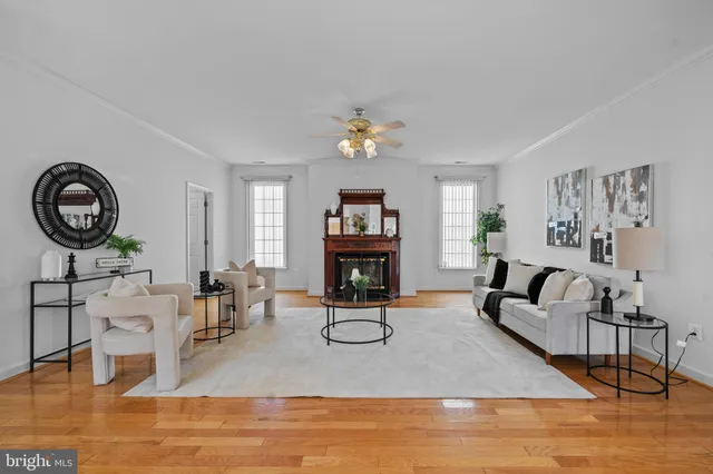 a living room with fireplace furniture and a window