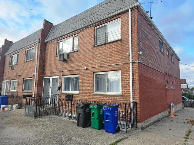 a front view of a house with parking
