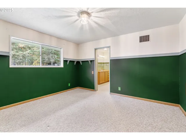 a bathroom with a sink mirror and a shower