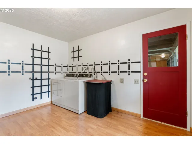 a view of house with backyard and sitting area