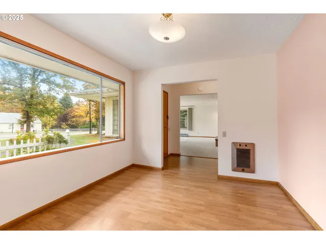 a kitchen with stainless steel appliances sink cabinets and window