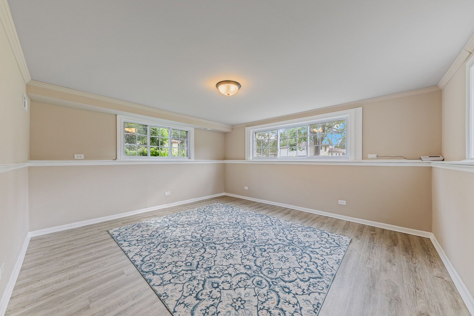 303 Springfield Street Park Forest, IL 60466 - Photo 11 of 16 wooden floor in an empty room with a window