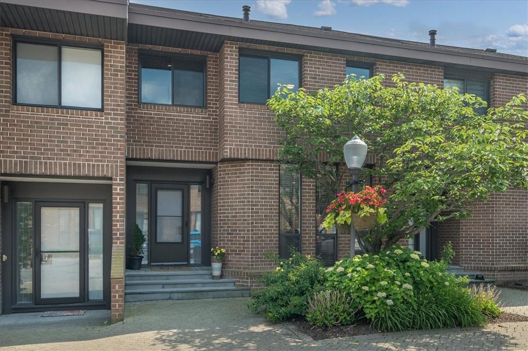 27 Waters Edge Rye, NY 10580 - Photo 1 of 1 a front view of a house with plants